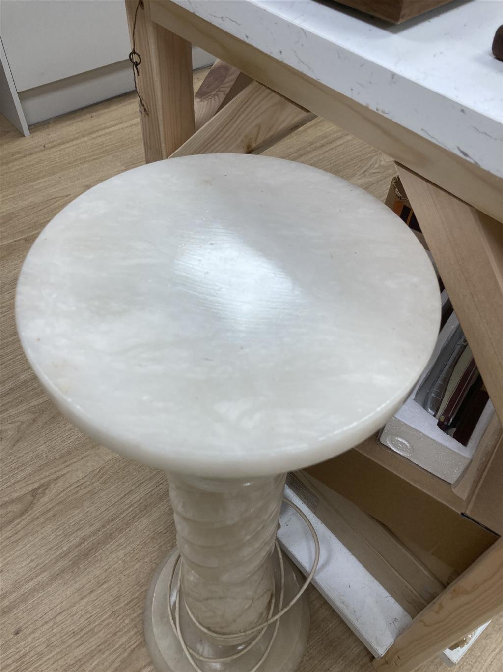 A white carved alabaster pedestal, 80cm high